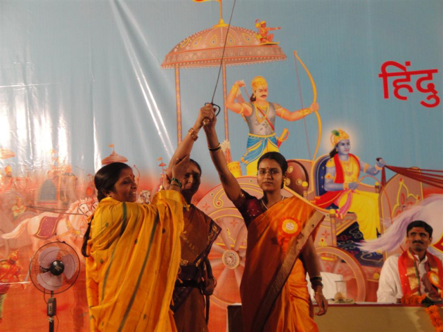 'Rashtraseva Samiti' members felicitated Ms. Sphurti Benkanwari by presenting a sword 'Rashtraseva Samiti' members felicitated Ms. Sphurti Benkanwari by presenting a sword